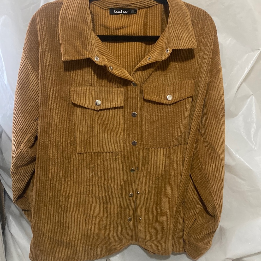 Teddy cardigan never worn! 100% polyester! Can be buttoned up and be worn open.